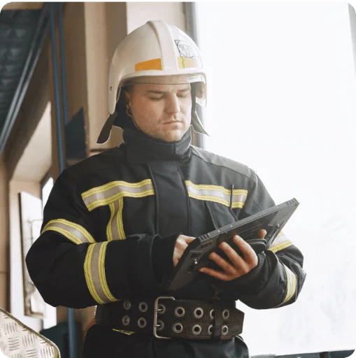 Firefighter holding tablet